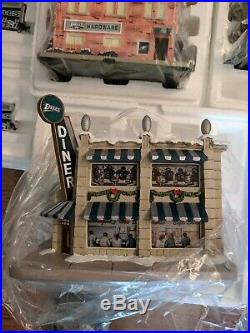 Eagles Hawthorne ho train set and Christmas village, brand new, never used